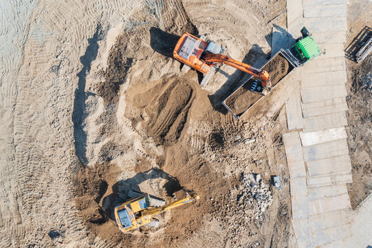 Aerial View of Construction Site with Excavators and Dirt Moveme