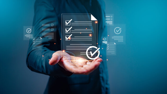 Image of a businessman using a computer to access cloud services for document management and digital file storage and transfer. Ideal for illustrating concepts like document sharing, file access, data