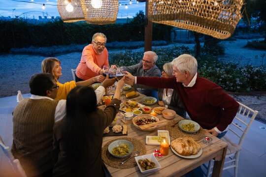 Dinner gathering with friends enjoying a delicious meal outdoors