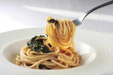 A photo of a forkful of steaming spaghetti with shiny noodles and spinach sauce