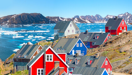 Picturesque village on coast of Greenland - Colorful houses in Tasiilaq, East Greenland © muratart