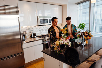 Stylish Gay Couple making Flower composition in the kitchen
