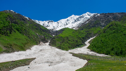 Stunning view of melting glaciers in Dayitar Valley, Nagar, Gilgit, Pakistan, surrounded by lush...