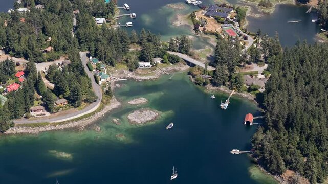 Aerial view of Sechelt, British Columbia, Canada. Sailboats, houses, trees, and clear water.