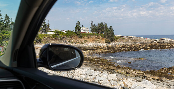 Maine Coast summer lighthouse from car window