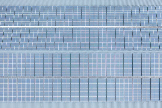 Large Solar Panel Array Installed on a Pitched Rooftop