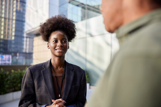 Young professional listening to boss