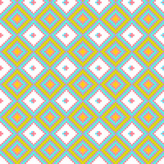 Colorful geometric pattern featuring diamond shapes in pink, yellow, and turquoise against a white background.