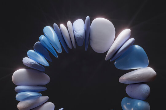 Stacked blue and white stones on a dark background