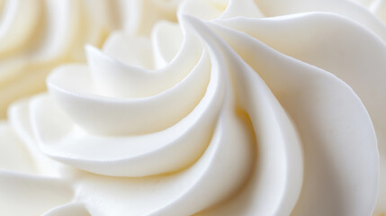 Smooth, swirled white cream or frosting, showcasing the texture and richness of the confection.