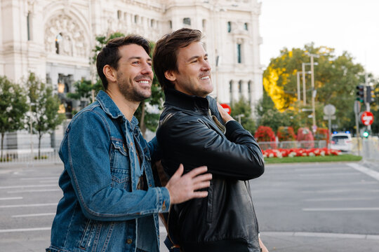 Couple enjoying a sunny day on the vibrant streets of Madrid