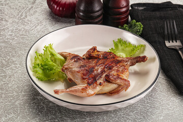 Grilled quail in the plate