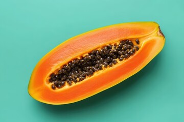 A ripe papaya fruit cut in half showing its seeds and flesh