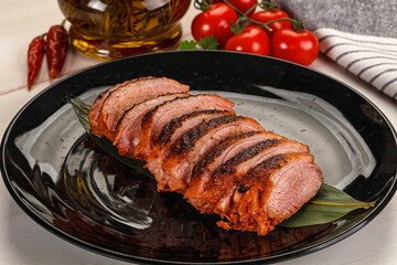 Sliced duck breast baked with cherry