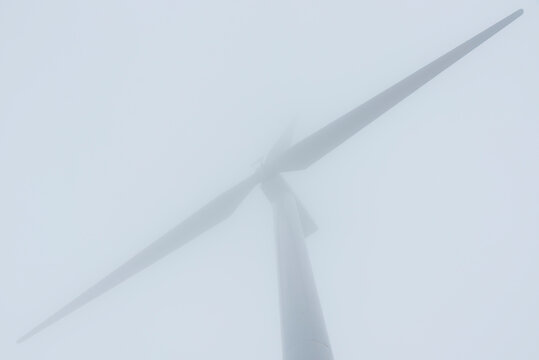 Spinning Wind Turbines in the fog