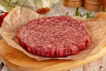 Fototapeta premium Raw beef cutlet for burger
