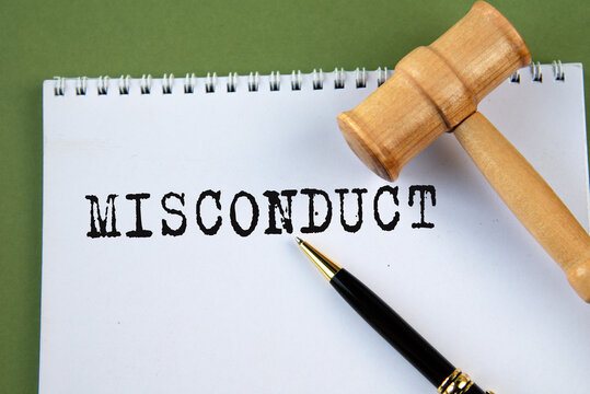 MISCONDUCT - word on a white sheet with a judge's gavel