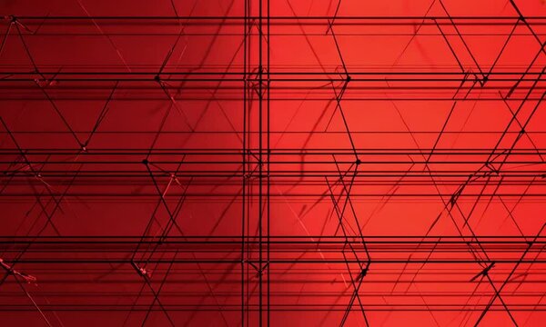 A seamless background animation featuring a straightforward red grid pattern interspersed with black lines. This artistic texture consists of square tiles, presenting a modern geometric design
