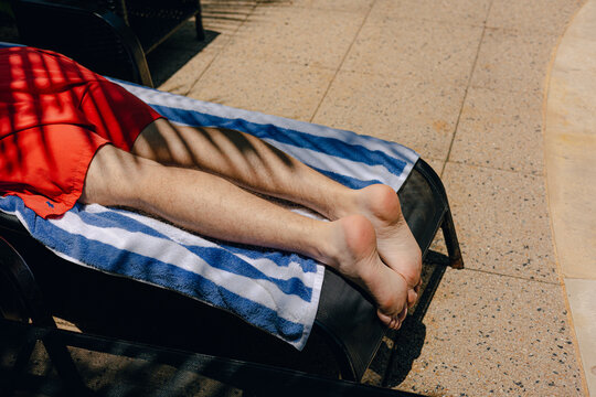 A person Lounging by the pool 