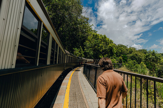 A person walks along side the train at Barron George National Park 