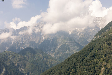 High angle view of green forest mountain after rain There was a dense white rain mist that looked fresh. the rainforest looks lively.