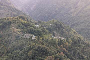 High angle view of green forest mountain after rain There was a dense white rain mist that looked fresh. the rainforest looks lively.
