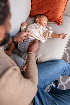 Baby getting diaper changed at home