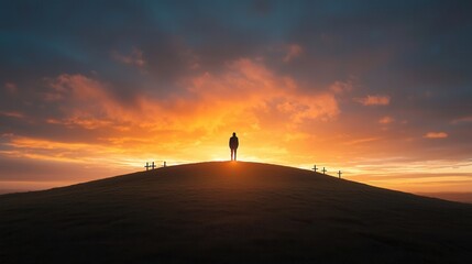 Fototapeta premium A breathtaking sunset casts a warm vibrant glow over a serene landscape dotted with silhouetted crosses creating a powerful and introspective scene