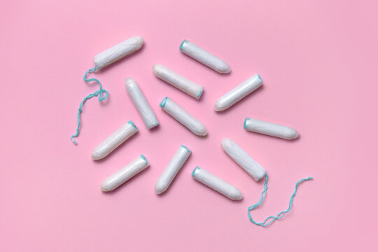 Feminine hygiene products on a pink background 