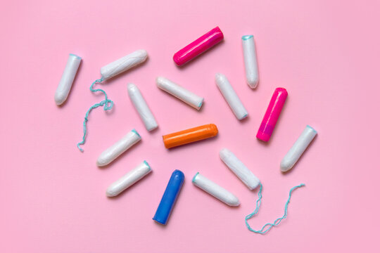 Feminine hygiene products on a pink background 