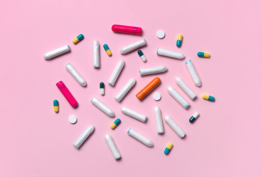 Feminine hygiene products on a pink background 