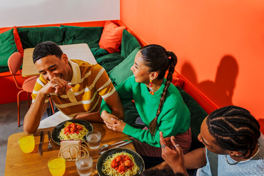 Friends enjoying lunch at colorful restaurant