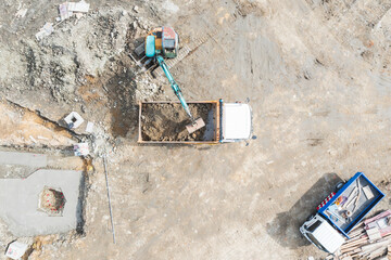 Aerial Excavator Loading Dump Truck at Construction Site Work