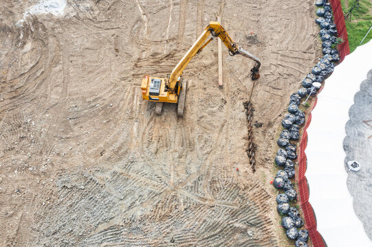 Aerial View Pile Driver Installing Steel Beam at Construction Si