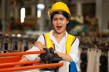 First Aid and safety first concept. Engineering mechanic woman hand accident unconscious at industrial factory