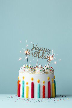 Happy birthday cake with sparklers and piped buttercream birthda