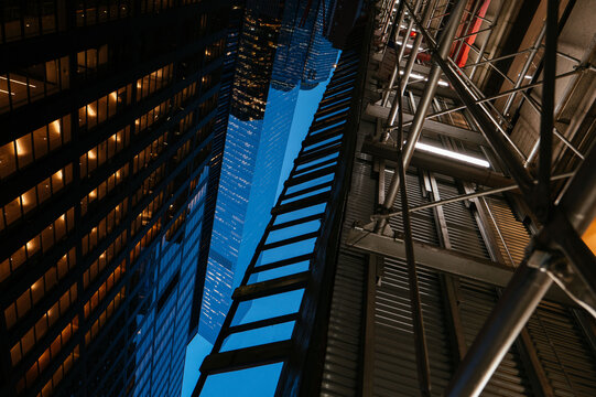 Skyscraper reflection framed by NYC scaffolding