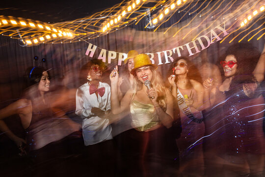 Celebratory birthday party with joyous atmosphere and music