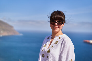 Smiling woman with ocean view in Tenerife........