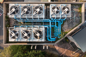 Aerial View of Rooftop Cooling System with Fans and Pipes