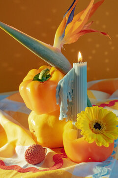 Art stil life fruit and candle arrangemen.
