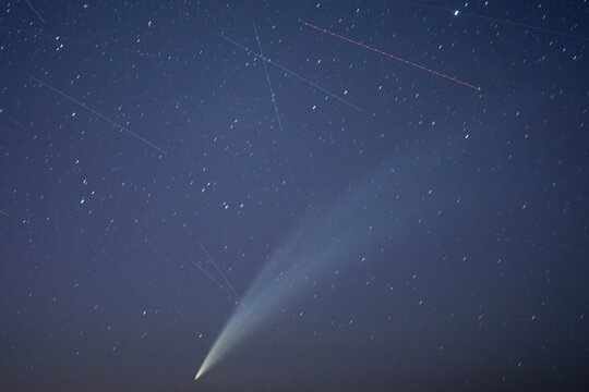Comet Atlas with numerous satellites and an aircraft. South Australia.