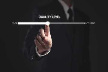 Businessman hand pointing to change quality level indicator scale from poor to excellent for customer satisfaction and evaluation concept. 