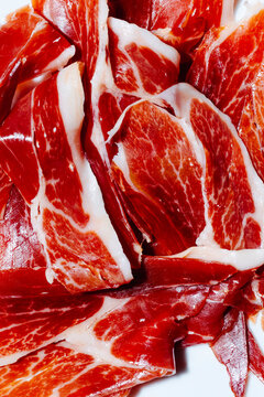 slices of spanish serrano ham on a plate