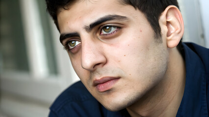 Obraz premium Close-Up Portrait of a Young Turkish Man with Gray Eyes. Perfect for: Men's Fashion Editorials, Turkish Heritage Celebrations, Luxury Campaigns, Business Portraits