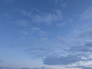 Moon in winter sky at twilight