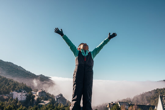 Young adventurer enjoying the mountain landscape scenery