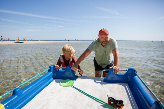 family having fun on catamaran ride