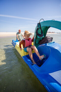 family having fun on catamaran ride