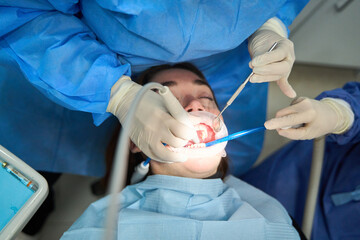 Dentists performing dental procedure on patient